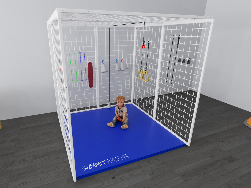 Image of a Summit Sensory Gym Universal Exercise Unit, also known as a Spider Cage, featuring a white metal grid frame with various therapy accessories, including resistance bands, handles, and cones, neatly organized. A young child is seated on a bright blue mat within the cage, which is labeled with the Summit Sensory Gym logo. The surrounding environment is a clean therapy room with wood-style flooring.